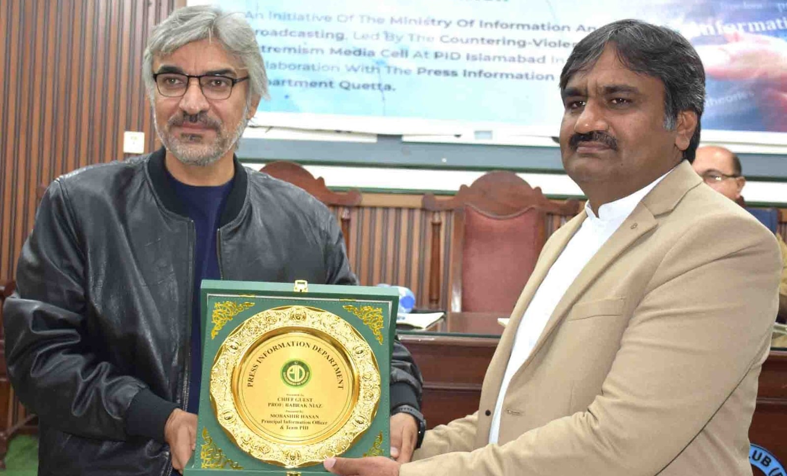 Project Director Shahid Imran Ranjha presenting shield