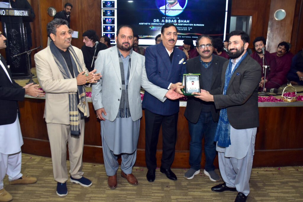 Dr Abbas Shah being honored by the title of health ambassador