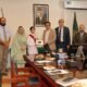 Federal Minister Giving tablet to FBISE 2nd Position Holder